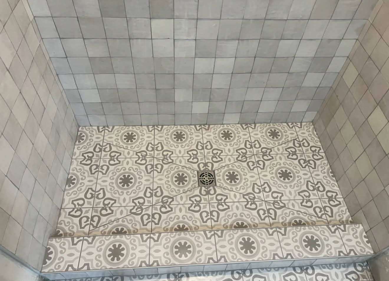 Cement encaustic tile shower floor
