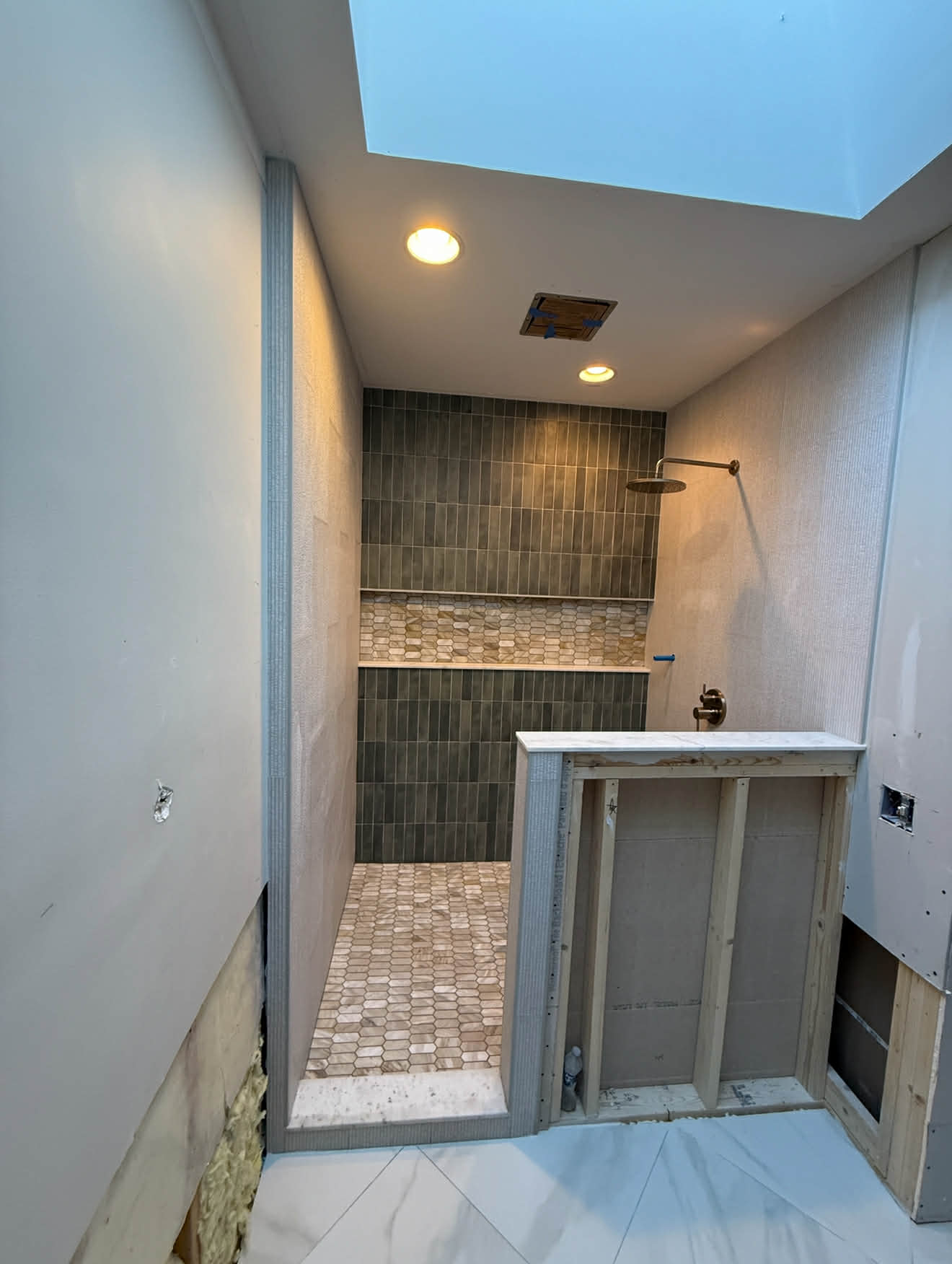 Full bathroom with walk-in shower, subway tile and pebble floor
