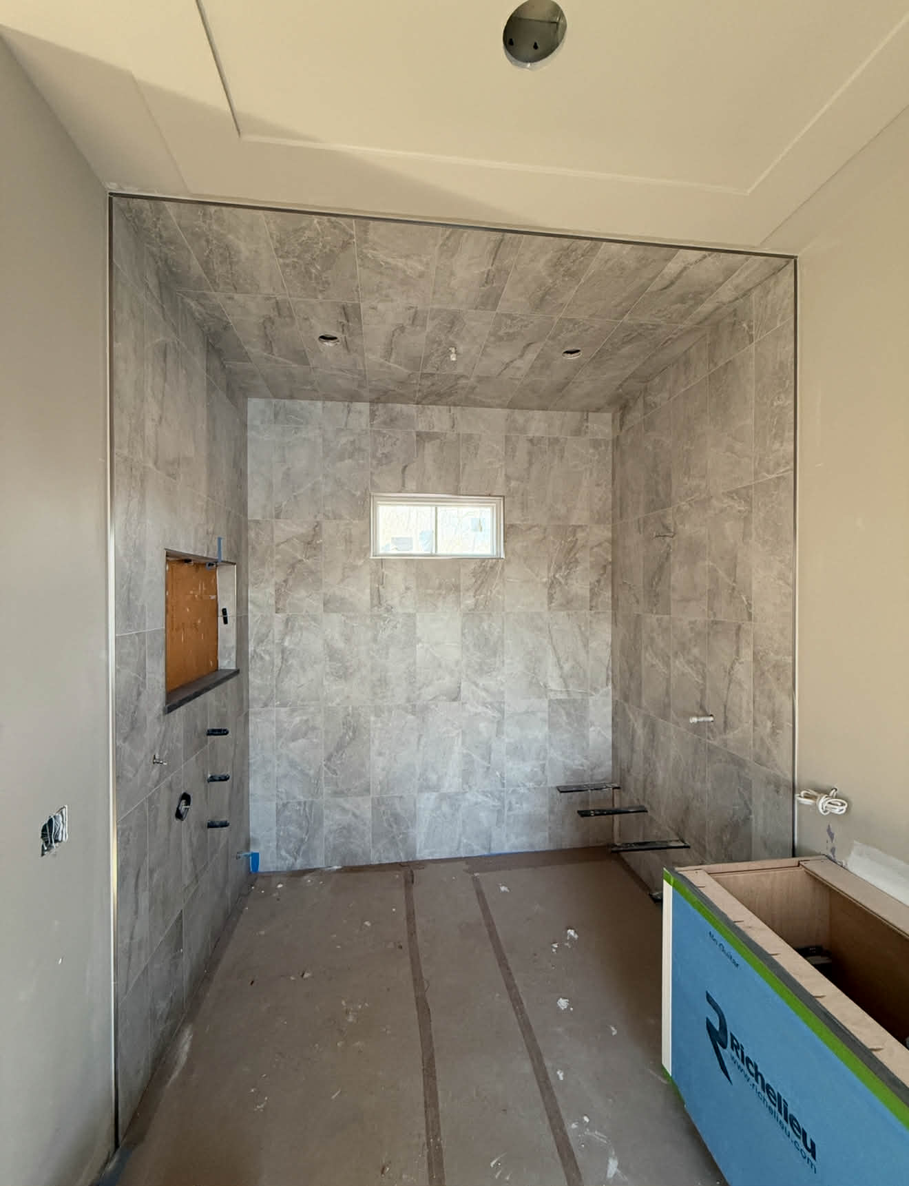 Marble shower bench and niche detail